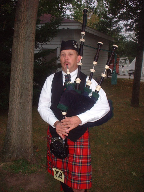 Baltimore Bagpiper Paul Cora playing moving tunes on his bagpipes