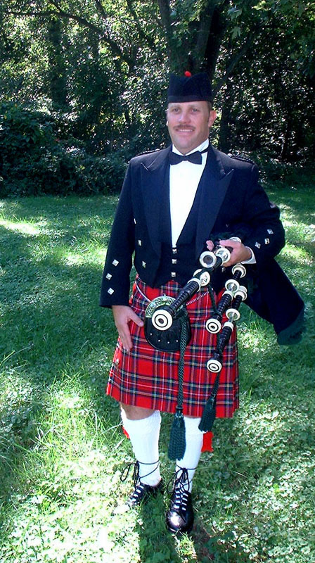 Baltimore Bagpiper Paul Cora taking a break from piping music on his bagpipes